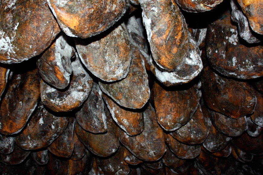 The process of drying and curing Iberian hams in natural cellars Spain